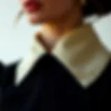 A close-up of an asymmetrical collar detail showcasing intricate stitching and fabric texture