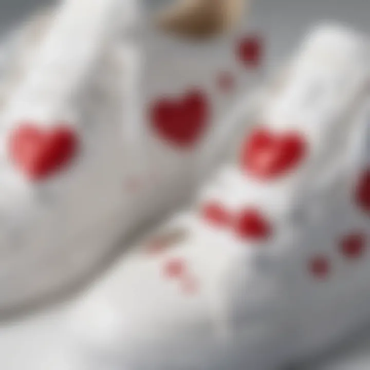 Close-up of heart motifs on white sneaker