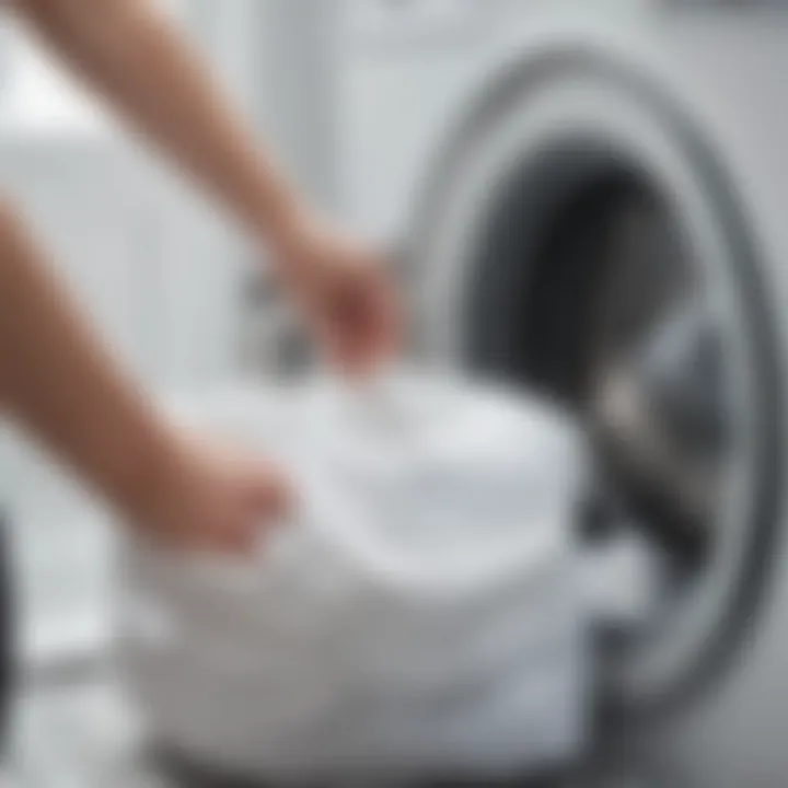 Close-up of delicate fabric being placed into a washing machine bag