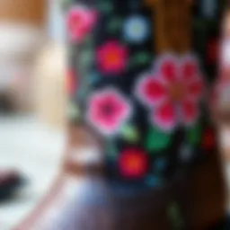 A close-up view of intricate floral embroidery on a cowgirl boot