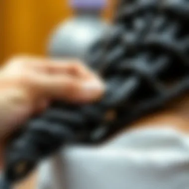 A close-up view of dread extensions being applied to natural hair for a seamless look