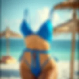 Bright blue high-waisted bikini displayed on a beach setting