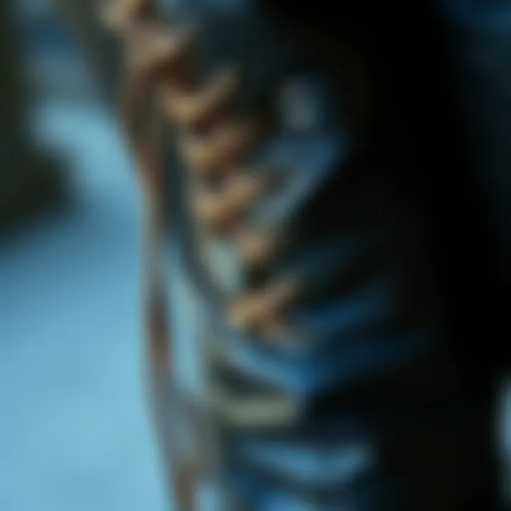 Close-up of intricate lace-up detailing on leather pants
