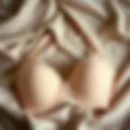 Stylish nursing bra with removable pads displayed on a soft fabric background