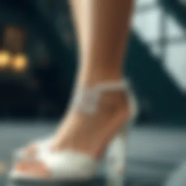 Intricate Ankle Strap Design Close-up of the intricately designed ankle strap on white high heel sandals.