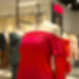 Elegant display of a vibrant ombre cold shoulder top on a mannequin