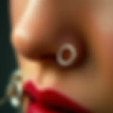 A close-up of intricate silver thin nose ring designs