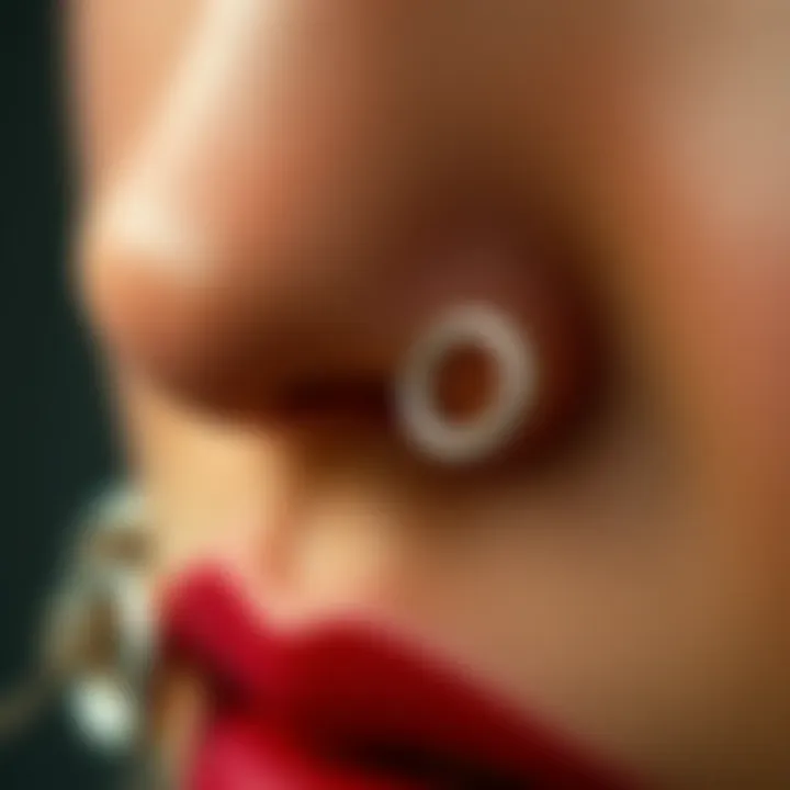 A close-up of intricate silver thin nose ring designs