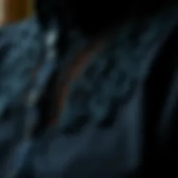 Detail of intricate lace design on a gothic button-up shirt