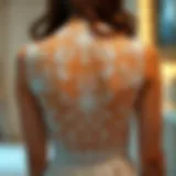 Elegant lace illusion back detail showcasing intricate craftsmanship.