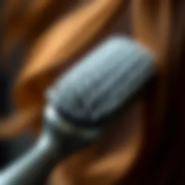 A close-up of a teasing hair brush showcasing its bristles and handle design