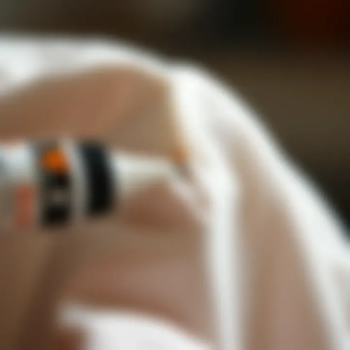 Fabric Repair Using Mending Glue A close-up of a fabric seam being repaired with mending glue